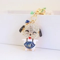 Mignon porte-clés chiot avec strass brillants et gilet bleu portant un symbole de chance - Bleu