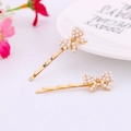 Elegante goldene Haarspangen mit zarten Perlen-Schmetterlings-Designs für Frauen - Schleife mit Perle