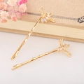 Dettaglio di eleganti fermagli per capelli ballerina in oro con cristalli di zirconia - Ballerina (Oro)