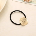 Minimalist black elastic hair tie featuring a textured gold-tone metal round ornament - Round Fine Stripes