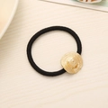 Elastic black hair tie featuring a detailed gold-plated straw hat alloy pendant - Bow Straw Hat