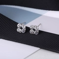 Detail view of S925 sterling silver flower stud earrings with clear cubic zirconia stones - Flower Silver