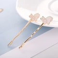 Detail süßer goldener Hasen-Haarspangen mit weißer Emaille und welligen Nadeln für Damen - Kaninchen