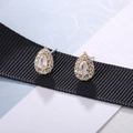 Macro shot of gold teardrop stud earrings with halo diamonds on black silk ribbon - Drop Shape (200013) / Water Drop Gold