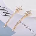 Detailed close-up of golden star hairpins featuring shimmering crystal rhinestones - Starfish Shape / Golden Sea Star