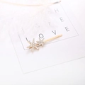 Sparkling gold star hair clip with rhinestones on a white feather and card display - White Star Snowflake