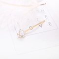 Elegant gold metal hair clip with white pearl flower design on a minimalist white background - Plum Blossom Pearl Clip