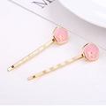 Set of two gold alloy hair clips with pink glittery five-point stars for women - Pink Star Style