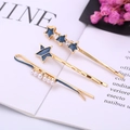 Set de tres horquillas para el pelo con estrellas azules, perlas blancas y pedrería dorada - Estrella Azul Oscuro