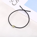 Elastico per capelli nero con perla a forma di cuore verde salvia su tessuto - Verde erba