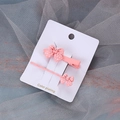Set de pinzas para el cabello con lazo rosa y lunares sobre una tarjeta blanca - Rosa Lunares Pequeños