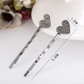 Juego de dos horquillas de corazón con diamantes en acabado negro humo y diseño ondulado - Corazón / Color gunmetal