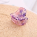 Macro detail of marble textured pink purple heart hair claw with glossy acetate finish - Purple Pink