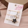 Three-piece set of golden star hair clips with white pearls on champagne satin background - Black Gray Star Set