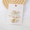 Lot de trois barrettes ailes pailletées bleues avec breloques étoile et lune sur base dorée - Ensemble Rose Nacré