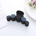 Detailed view of large matte black hair claw clip with blue and black circular accents - Medium / Blue Black (5 Pieces Decor)
