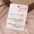 Dreiteiliges goldenes Haarklammer-Set mit Strass, Perlen und Schleifen-Details - Irisierendes Weiß