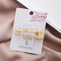 Dettaglio di fermaglio in resina trasparente con foglie d'oro su cartoncino decorato - Foglia D'oro Bianco Crema