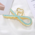 Detail of golden heart-shaped shark hair clip with light blue marble texture inlay - Sky Blue