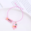 Pink elastic hair tie with lucky exam charms featuring success slogans and scroll design - Pink