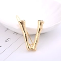 Golden V-shaped hair clip with branch-like texture for elegant hair styling accessory - Letter V