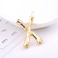 Golden X-shaped alloy hair clip with bamboo texture design and polished finish - Letter X