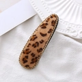 Detailed close-up of leopard print hair clip with gold rhinestones on velvet fabric - Khaki Waterdrop Style