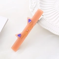 Cute pink cat hair clip in acetate resin with rhinestone accent on white mesh background - Orange