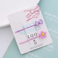 Haarspangen-Set mit rosa Blume und lila Schleife auf weißer Karte für Mädchen - Rosa Blume Und Lila Schleife