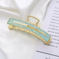 Elegante pinza per capelli in metallo dorato con intarsio in resina effetto marmo menta - Blu Lago