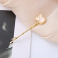 Cute golden hair clip with a pearlescent bear shape and pink purple shimmer design - Iridescent White