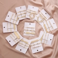Golden hair clip set featuring smiley face and geometric heart designs on white card - Multi-Style Combination