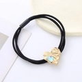 Elastic black hair tie with a gold heart pendant featuring a blue crystal stone - Emerald Green