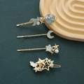 Set di 4 fermagli per capelli a tema stellare con stelle e luna in finitura oro - Azzurro