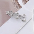 Close-up of three linked silver hollow hearts on a polished metal wavy hair clip detail - Silver Triple Heart Hollow Style