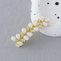 Elegant gold leaf hair clip with cat eye stones and sparkling crystal flower accent - Cat Eye Branch