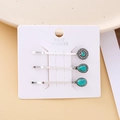 Gros plan de trois barrettes vintage en argent avec détails en pierre turquoise - Collection Rétro Turquoise