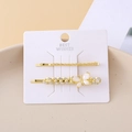 Detail of gold butterfly hair clips with mother-of-pearl wings and small crystals - Butterfly Chain Set