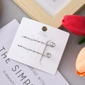 Close-up view of elegant silver bobby pins featuring oval crystal rhinestones on card - Ellipse / 2 Pcs/Set / Silver