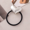 Minimalist brushed silver heart hair tie with black high-elastic rope on textured surface - Frosted Silver Heart