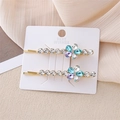Set de horquillas florales con cristales azules y violetas en base de metal dorado - Azul