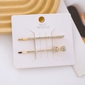Detail of elegant gold hairpin set with rhinestones and butterfly design on display card - Combination 6