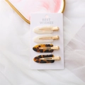 Set of four minimalist acetate hair clips in pearl white and tortoiseshell on a display card - Gold Clip Iridescent White Leopard