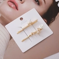 Detail of two gold hair clips featuring white resin rose and elegant faux pearls - Combo 10
