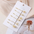 Lot de six barrettes à cheveux dorées avec strass en forme d'étoile, lune et ailes - Ensemble de Six Pièces Doré