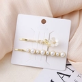 Elegante set van twee parel haarspelden met bloemmotief en gouden afwerking voor dames - Bloem 4 Combinatie