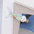 Detail of mermaid tail hair clip with iridescent laser scales and a heart pearl bead - Iridescent Fishtail Style