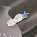 Detailed shot of cream shell and blue starfish hair clip with light blue pearls - Starfish Shell Style A