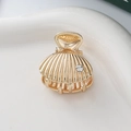 Elegant gold shell hair claw clip with rhinestones for a minimalist ocean-inspired hairstyle - Sea Shell Style 2