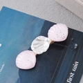 Detailed macro of a seashell hair clip with pink shimmer and central pearl detail - Pink Pearl Shell Style B